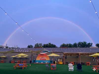 Rainbow over the Zoomies park at dusk